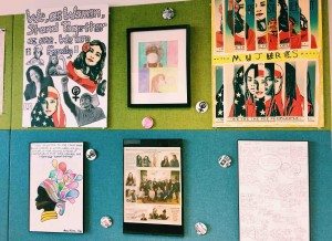 Youth artwork and a newspaper article featuring the March 2017 "Mujeres" exhibit that celebrated Women's History Month.